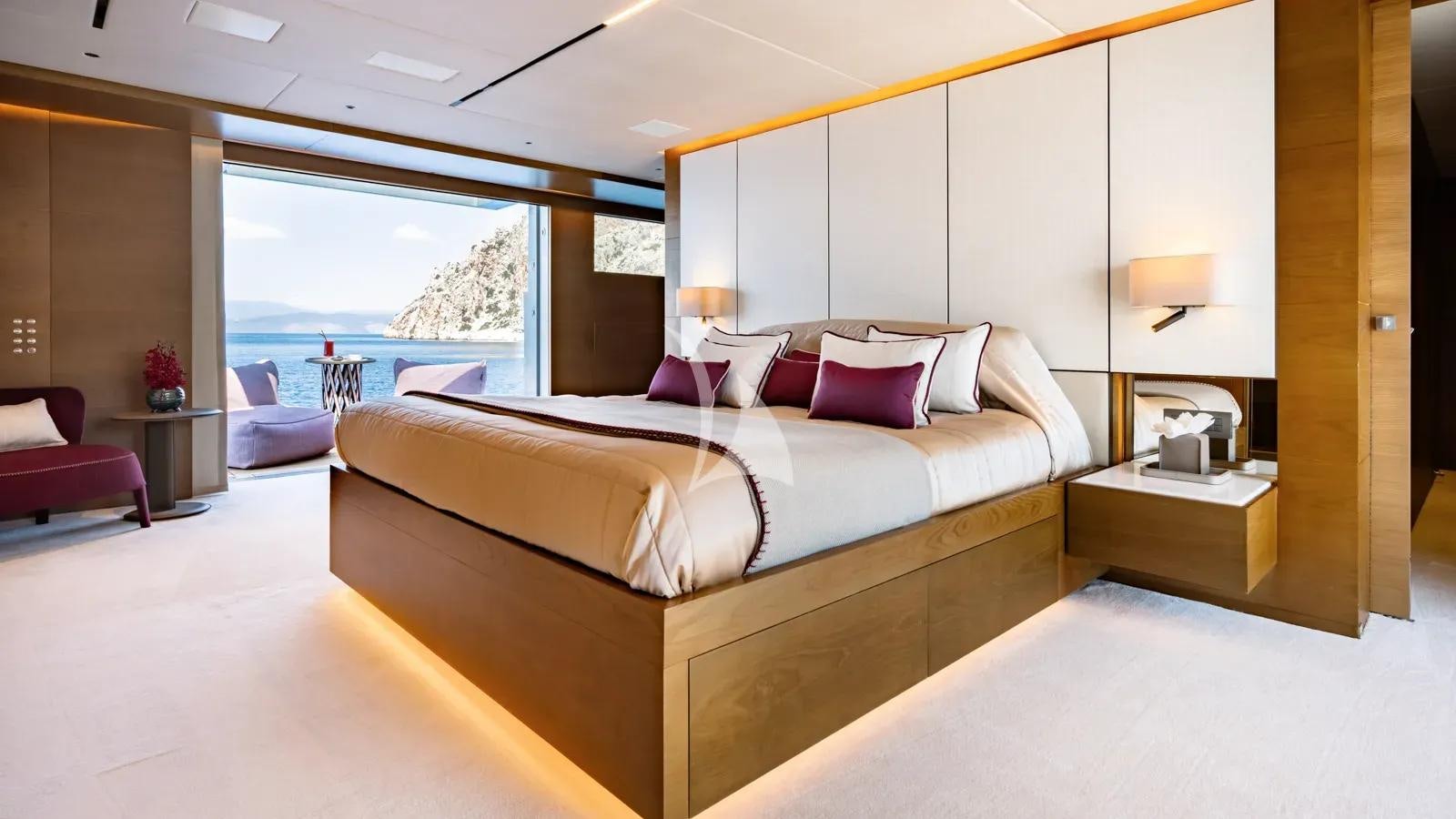 a large bed in a room aboard NAIA Yacht for Charter