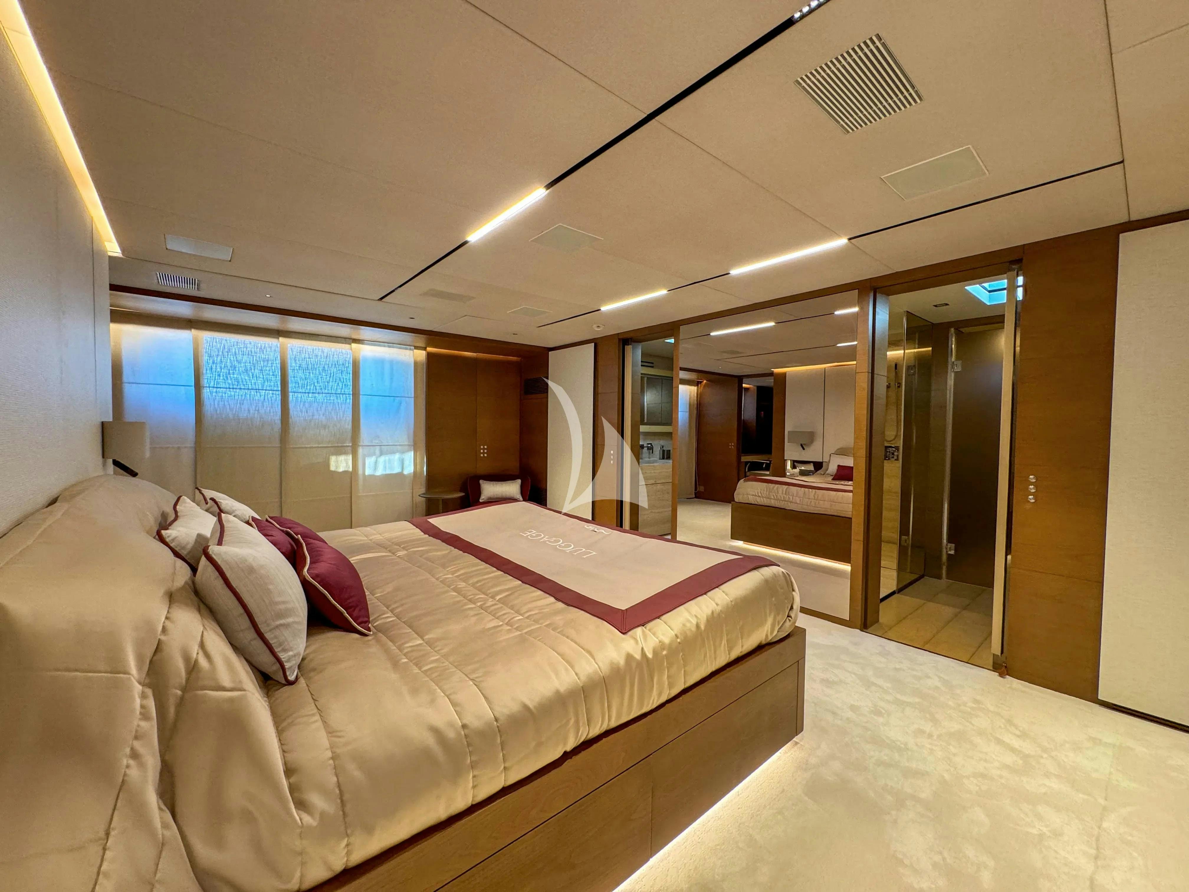a large bed in a room aboard NAIA Yacht for Charter