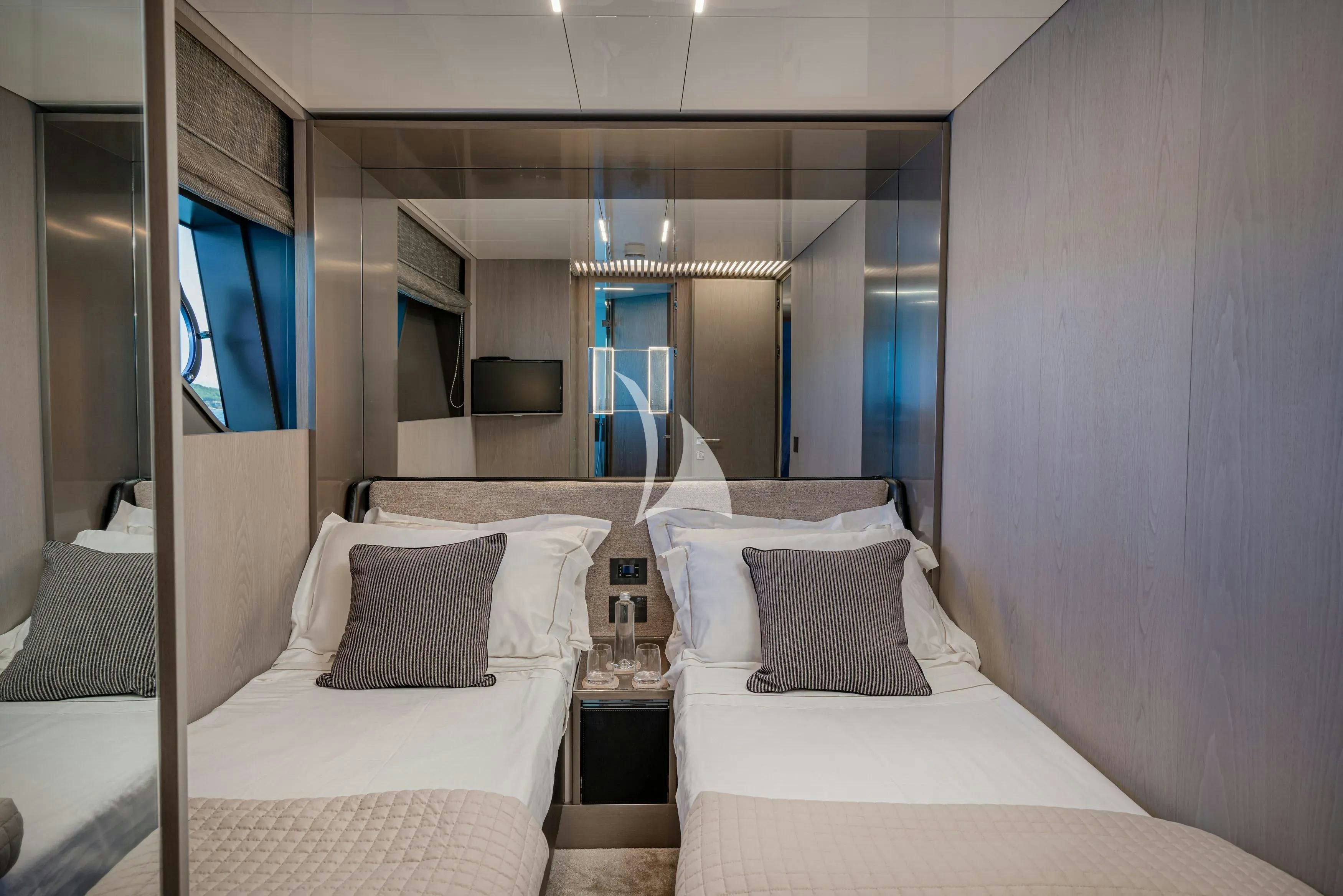 a room with two beds aboard E3 Yacht for Charter