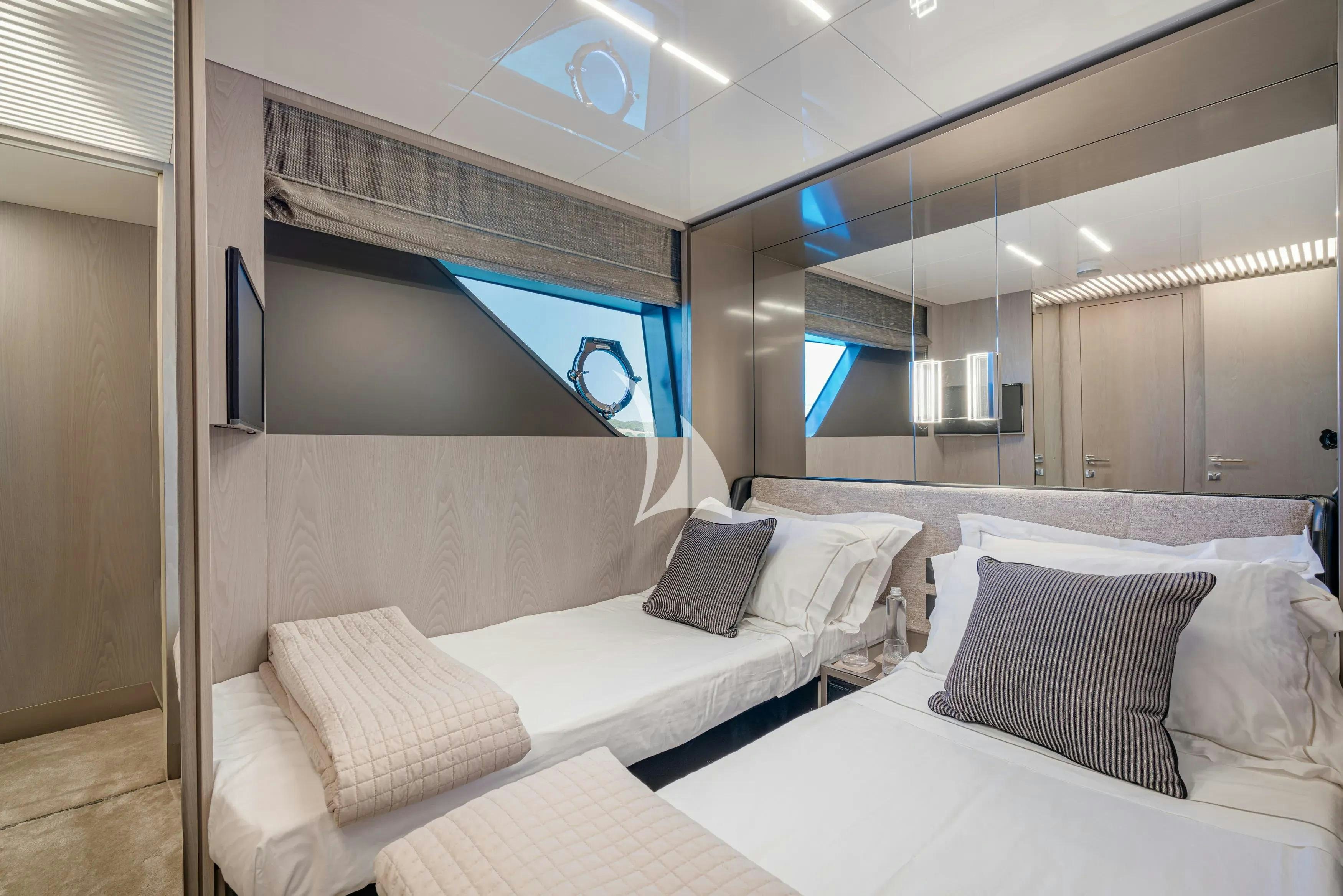 a room with two beds aboard E3 Yacht for Charter