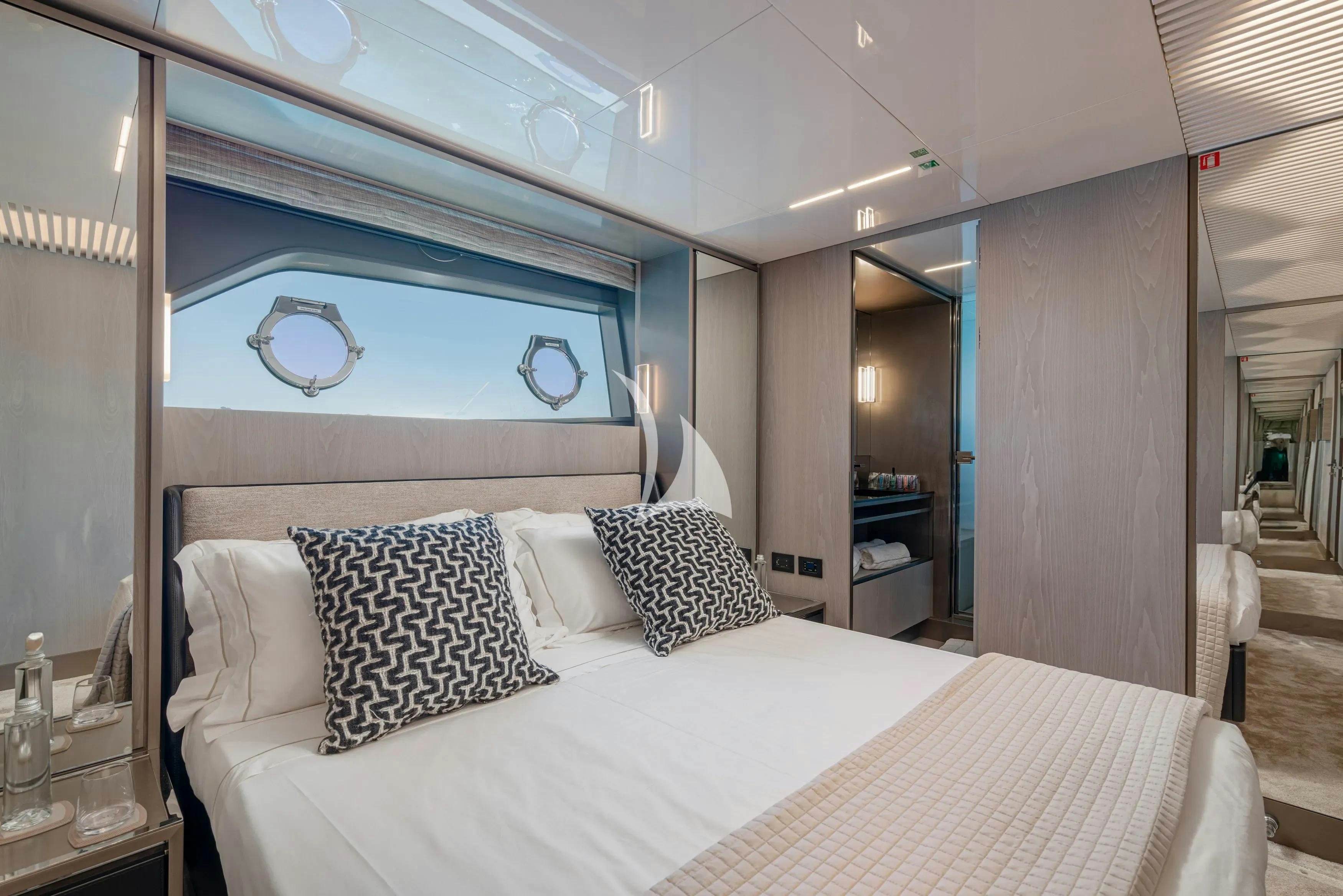 a bed with pillows aboard E3 Yacht for Charter