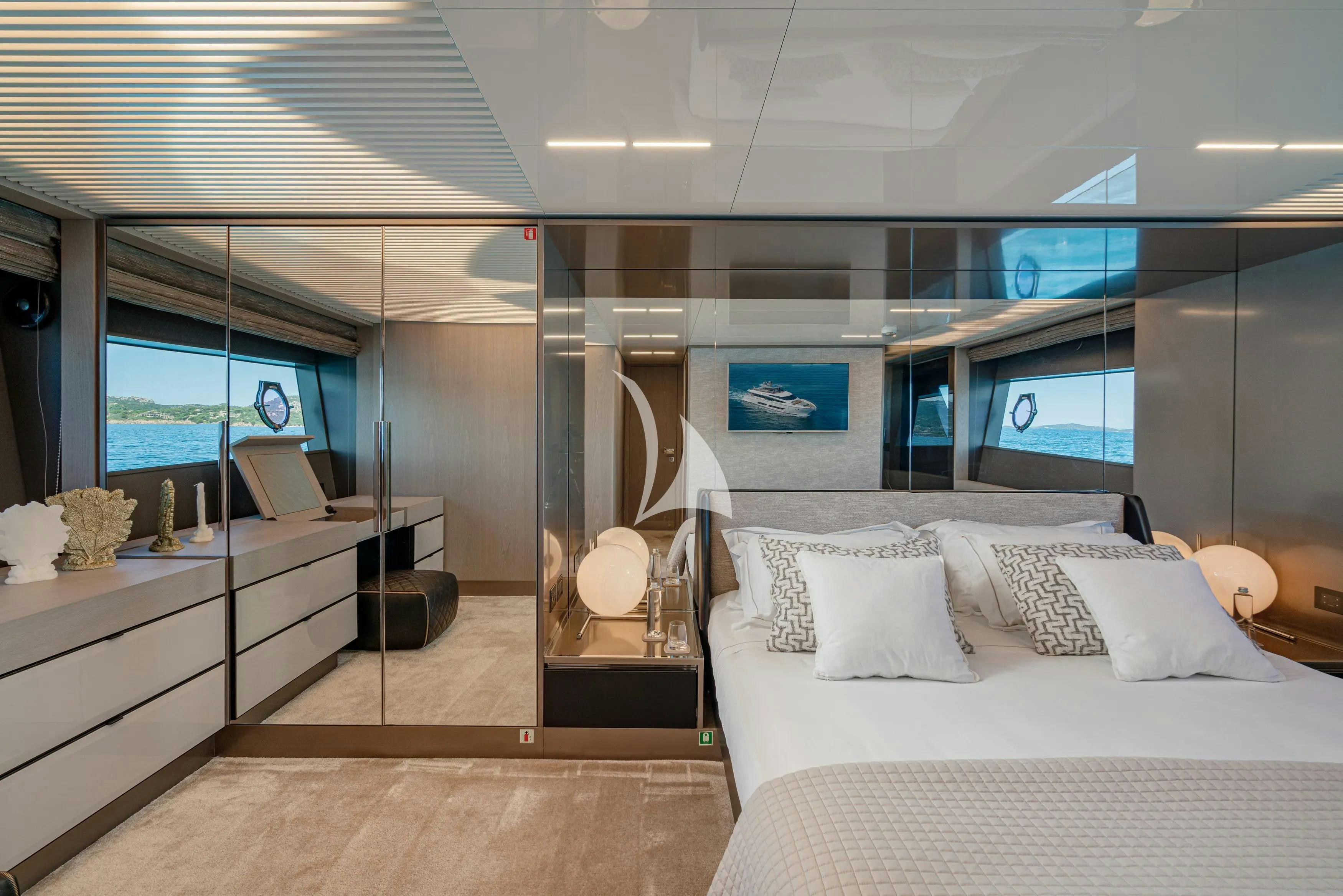 a room with a bed and a desk aboard E3 Yacht for Charter