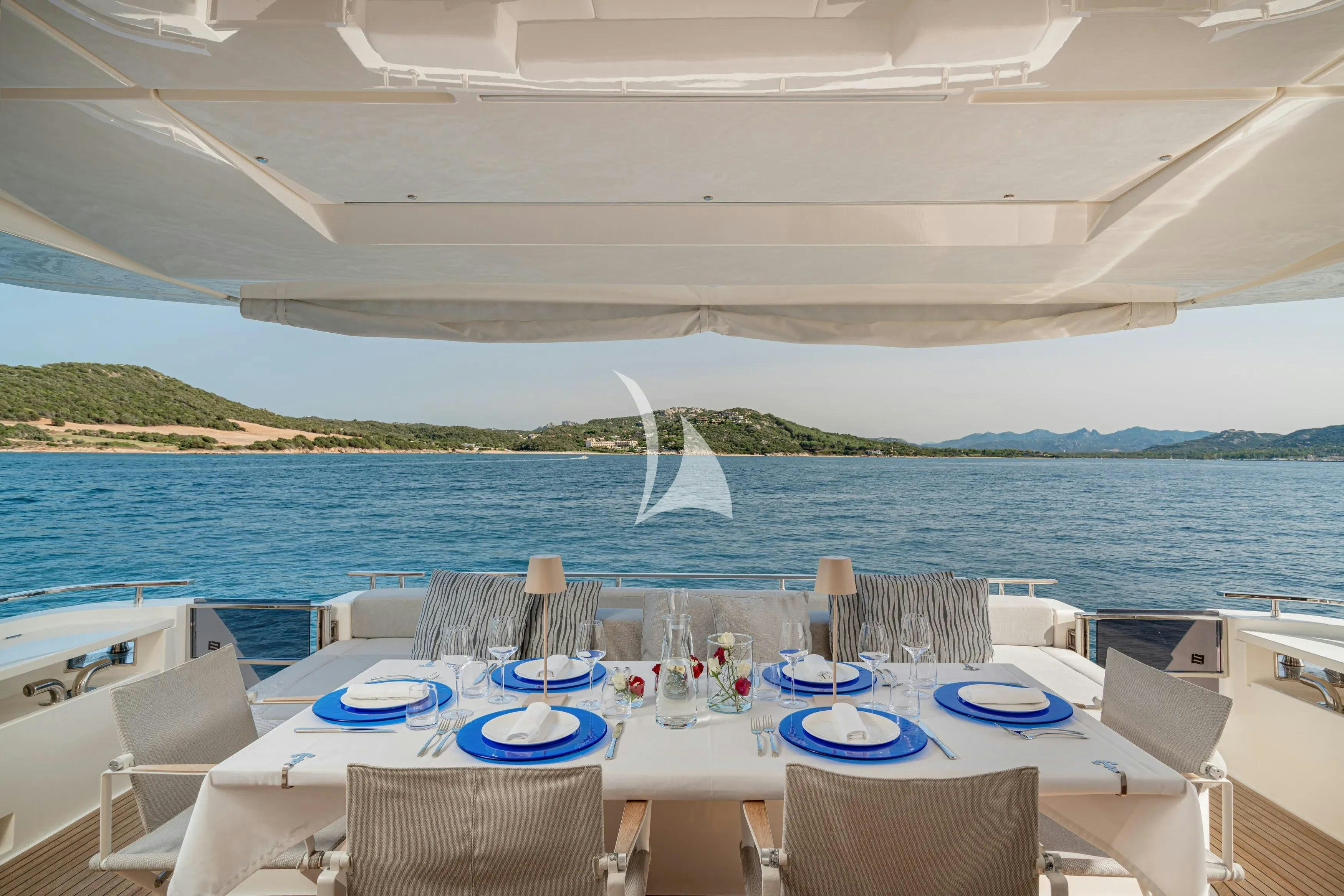 a table set for a dinner on a boat aboard E3 Yacht for Charter
