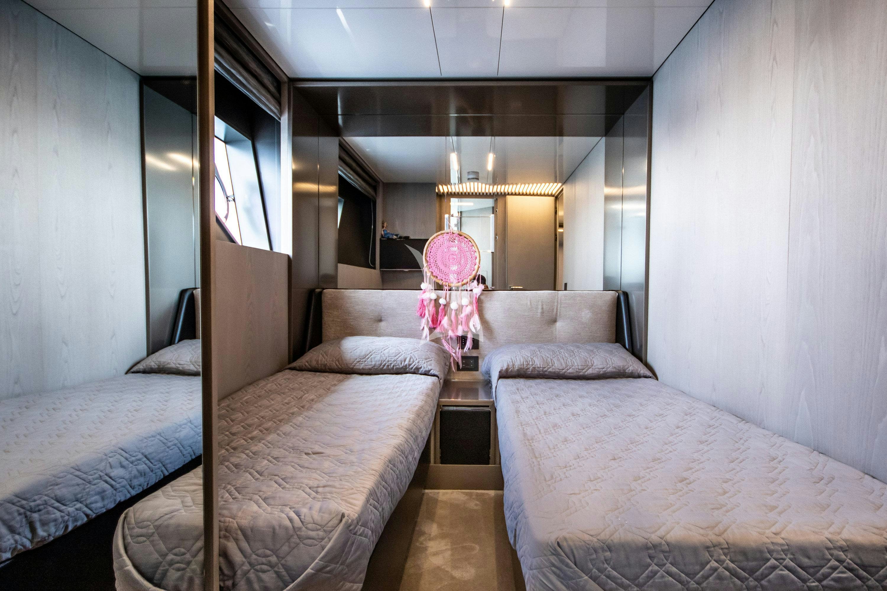 a room with two beds aboard E3 Yacht for Charter
