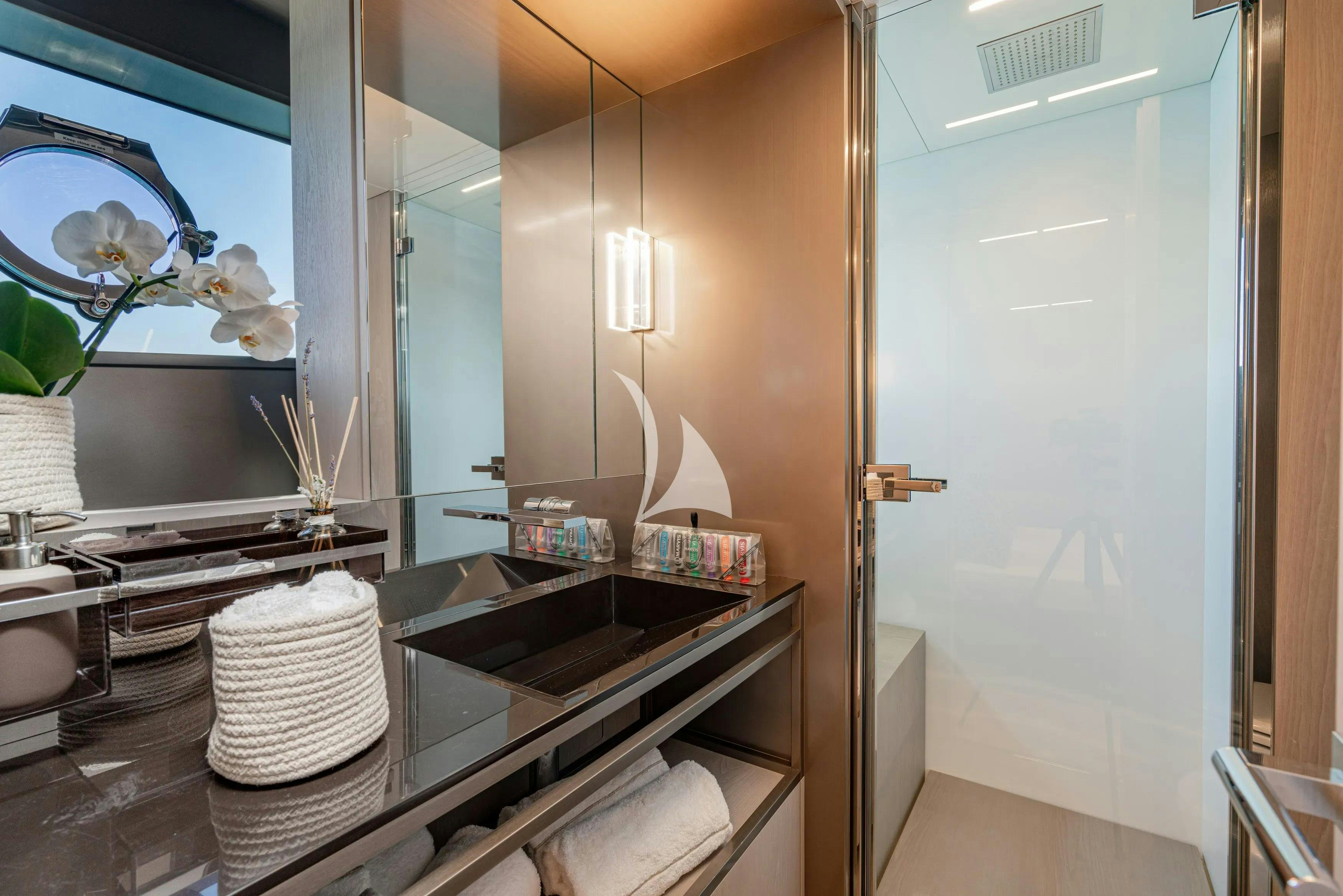 a kitchen with a sink and a mirror aboard E3 Yacht for Charter