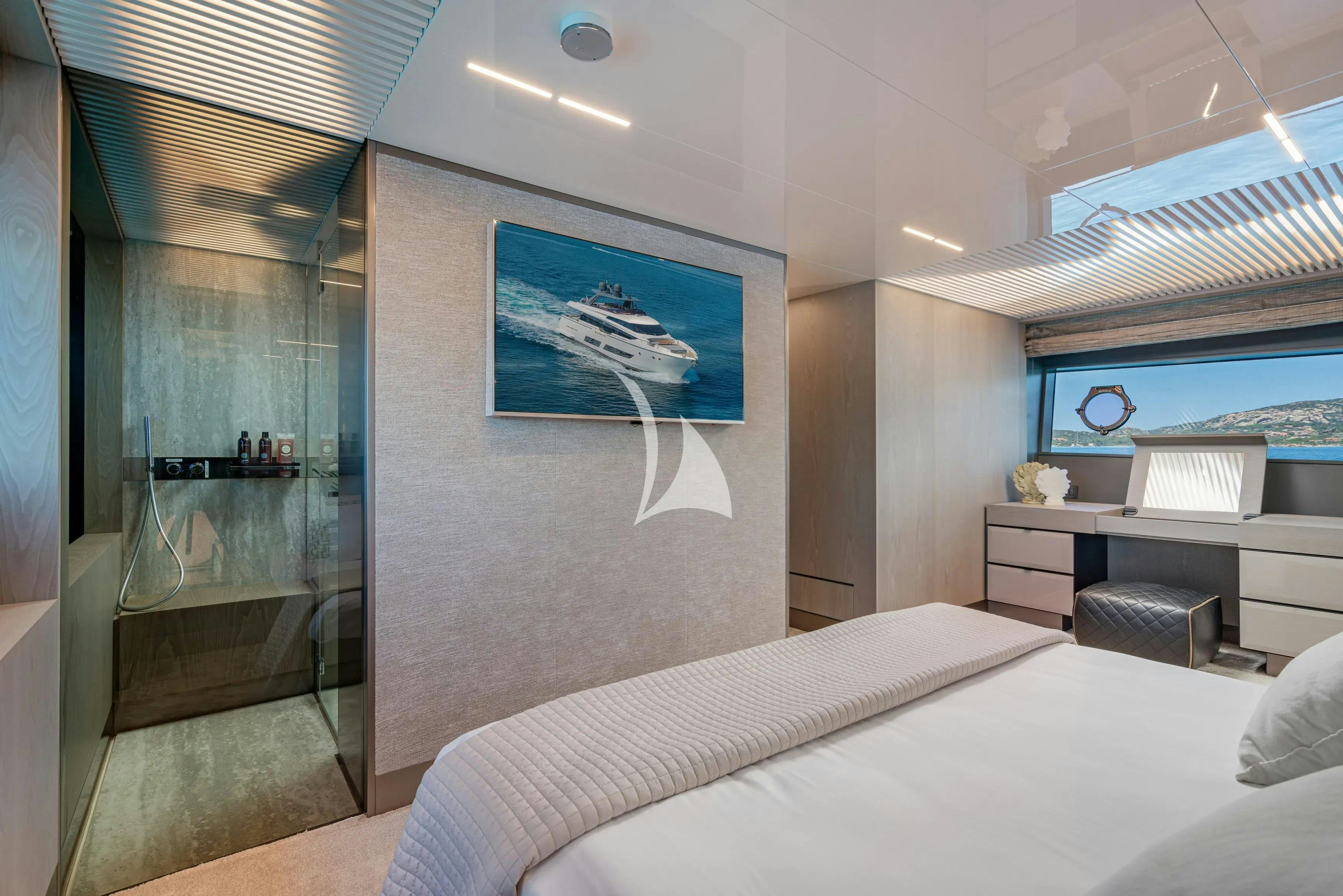 a bedroom with a bed and a desk aboard E3 Yacht for Charter