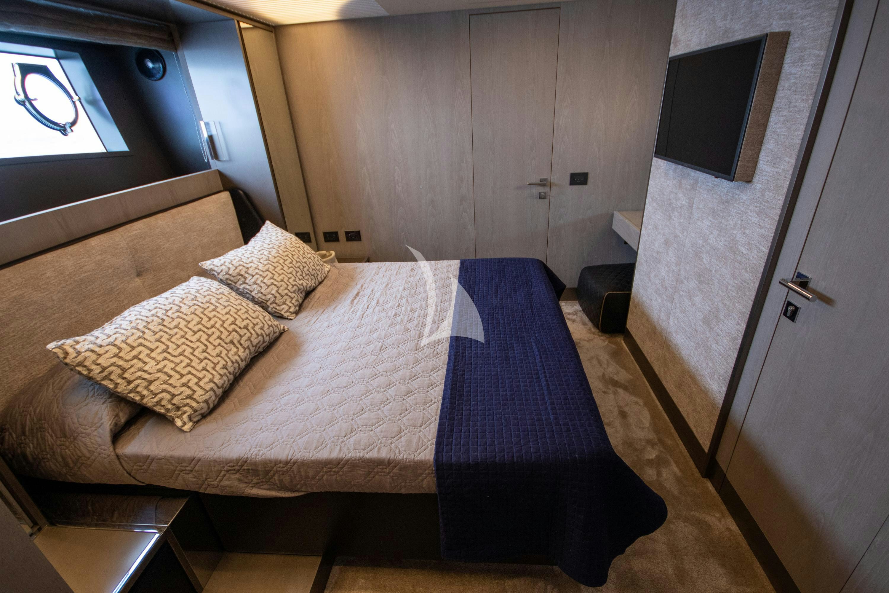 a bed in a room aboard E3 Yacht for Charter