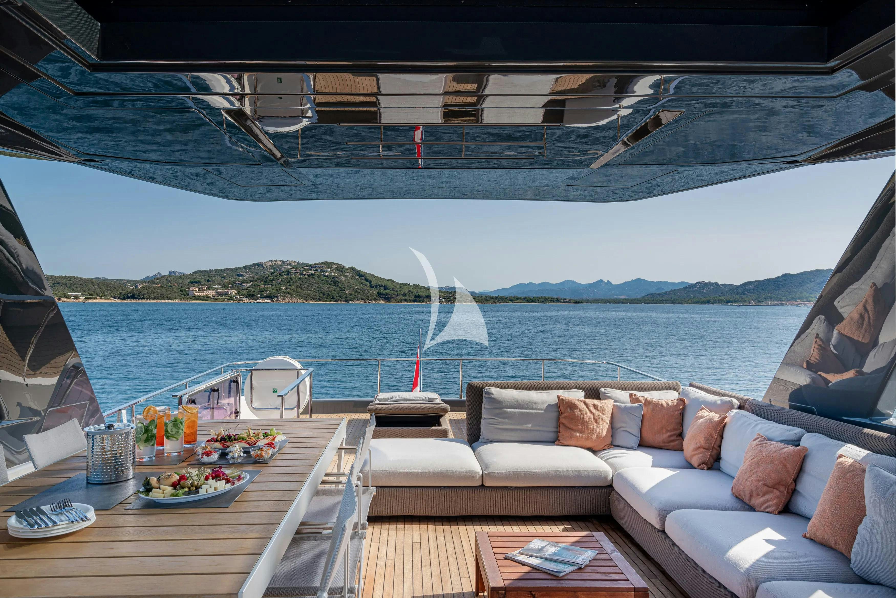 a couch and a table on a boat aboard E3 Yacht for Charter