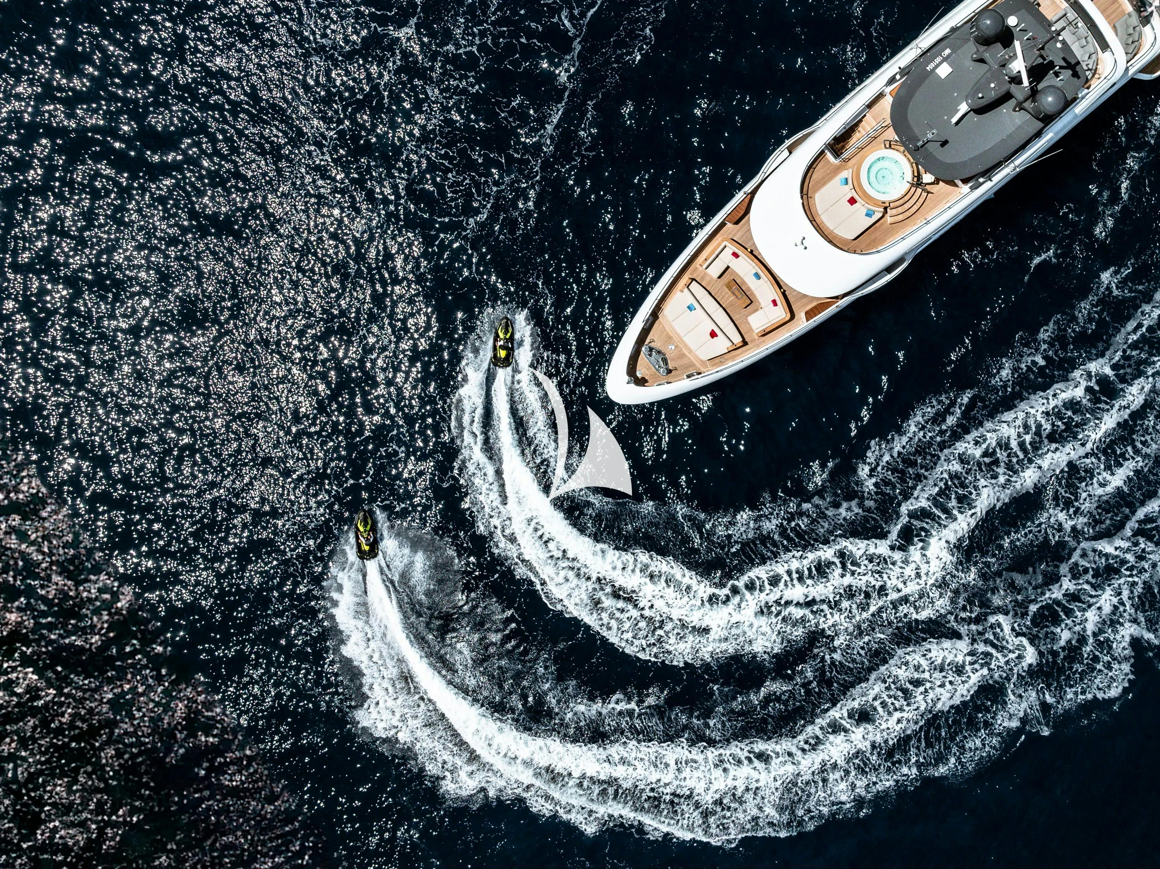 a guitar on a black surface aboard WAVE Yacht for Charter