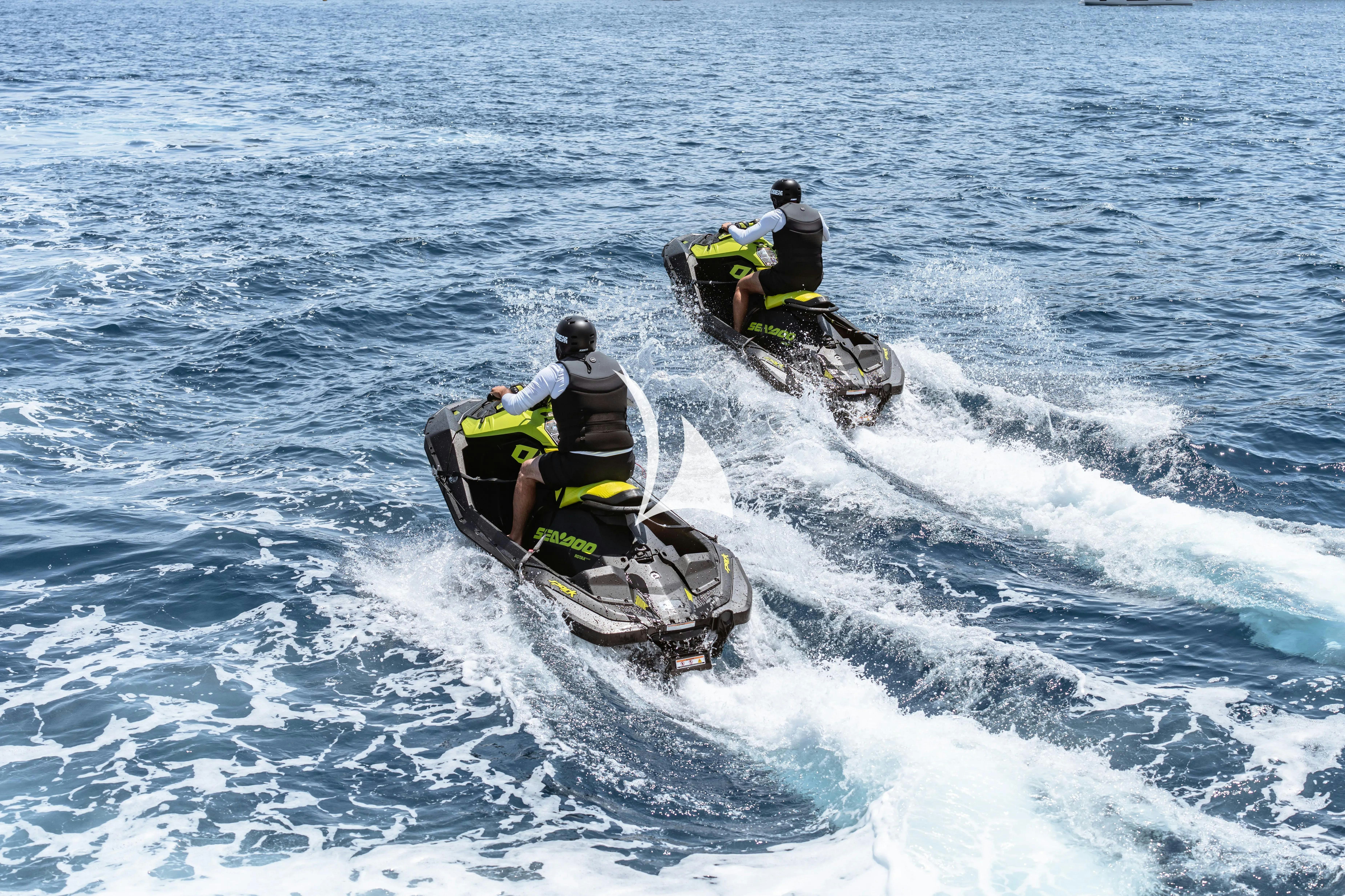 a man on a jet ski aboard WAVE Yacht for Charter