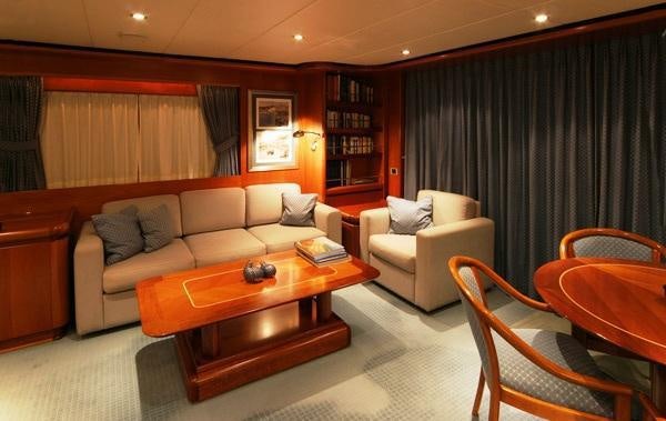 a living room with a couch and a coffee table aboard ALCOR Yacht for Charter