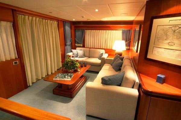 a living room with a couch and a coffee table aboard ALCOR Yacht for Charter