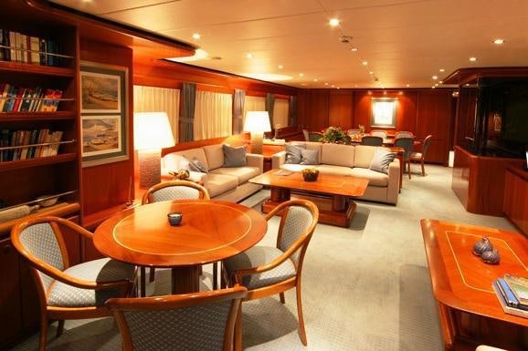 a living room with a table and chairs aboard ALCOR Yacht for Charter