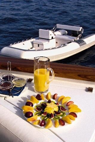 a tray of food by a boat aboard INOUIS Yacht for Charter