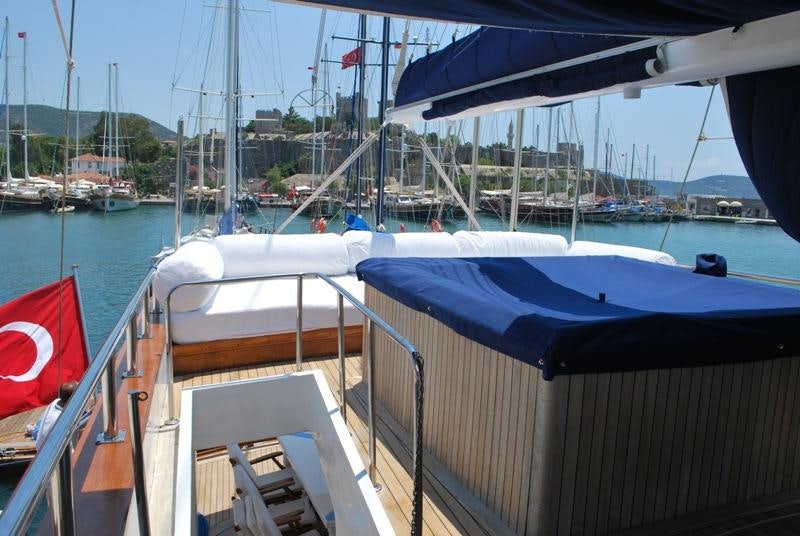 a boat with a flag on the deck aboard ESMA SULTAN Yacht for Charter