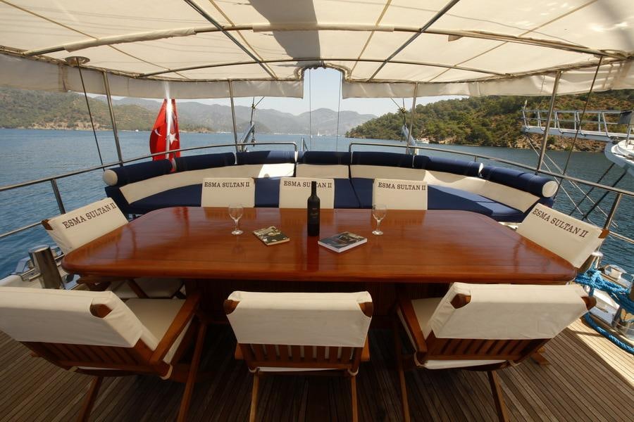 a wooden table on a boat aboard ESMA SULTAN Yacht for Charter