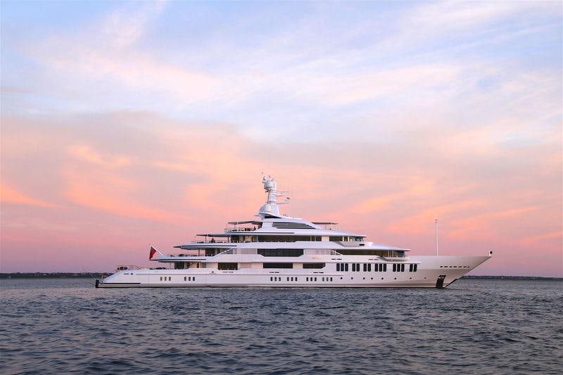 a large white boat in the water aboard SAMSARA Yacht for Charter