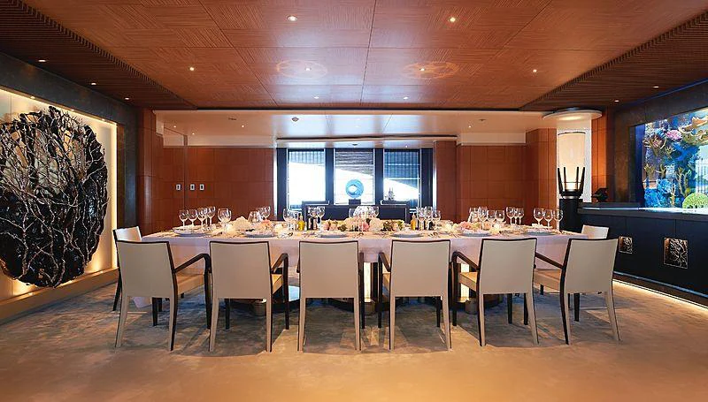 a large dining room with a large table and chairs aboard BARBARA Yacht for Charter