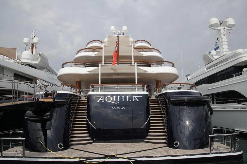 a large ship with a staircase aboard AQUILA Yacht for Charter