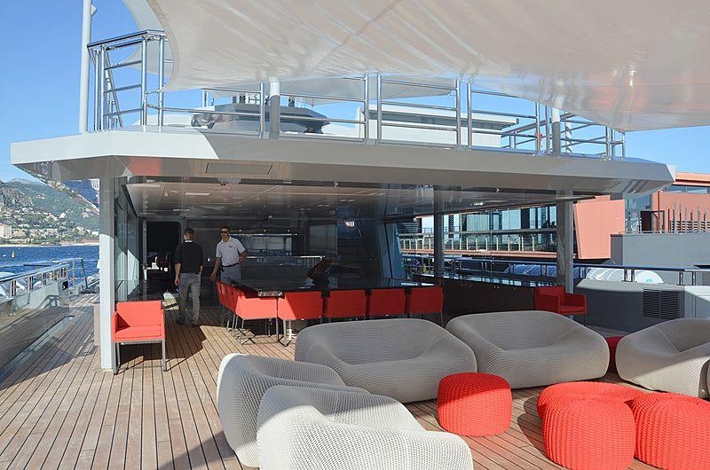 a room with a table and chairs aboard BOLD Yacht for Sale