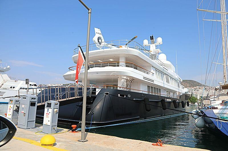 a large white boat docked aboard AIR Yacht for Charter