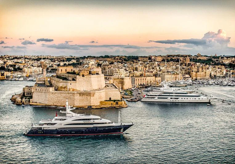 a city with boats in the water aboard BATELLO Yacht for Charter