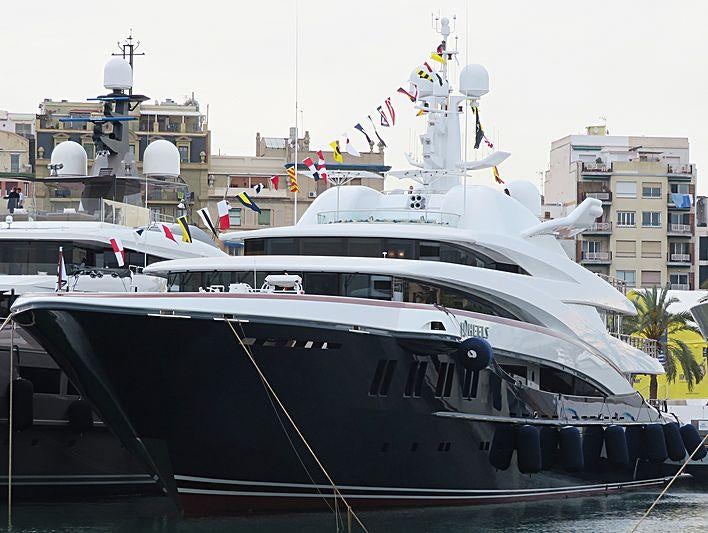 a large ship docked aboard WHEELS Yacht for Charter