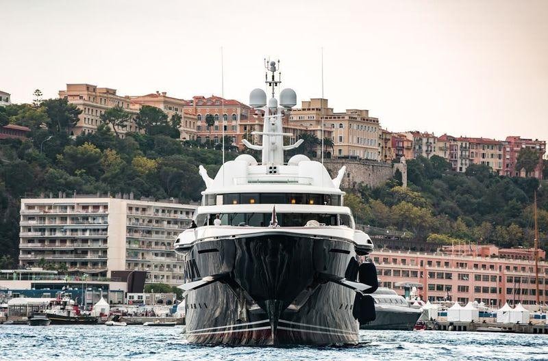 a large boat in the water aboard WHEELS Yacht for Charter