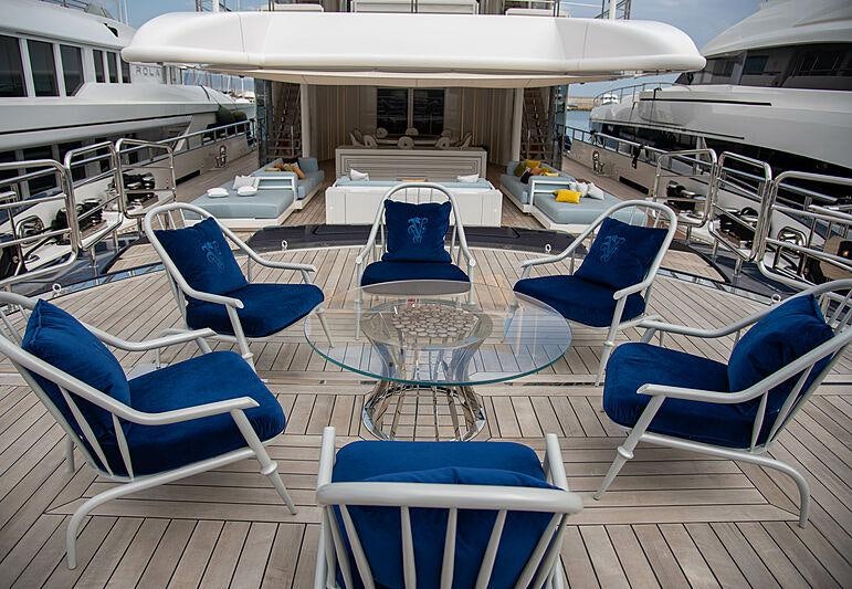 a group of chairs sit on a deck aboard LADY VERA Yacht for Charter