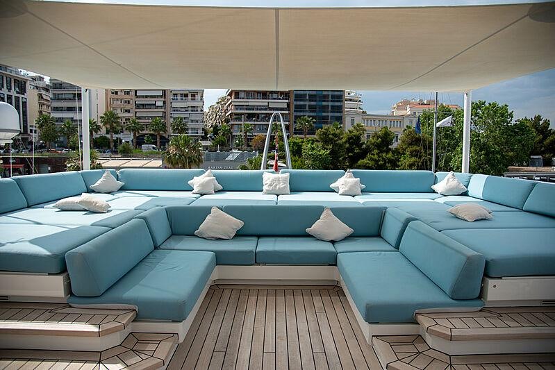 a pool with lounge chairs and pillows aboard LADY VERA Yacht for Charter