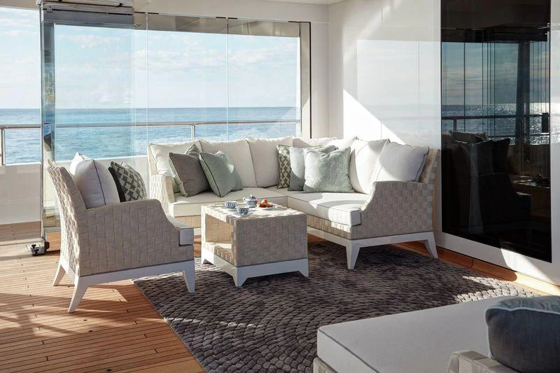 a living room with a large window aboard JOY Yacht for Charter