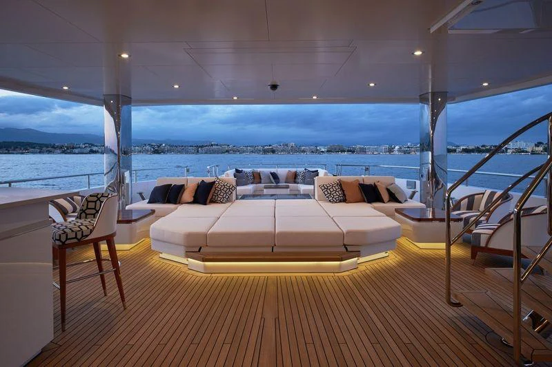 a room with a couch and a table and chairs aboard JOY Yacht for Charter