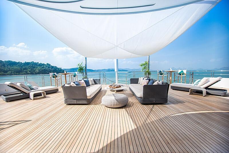 a lounge area on a deck aboard SALUZI Yacht for Charter