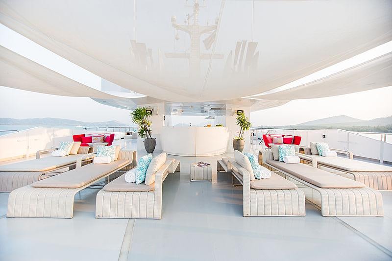 a modern living room with white furniture aboard SALUZI Yacht for Charter