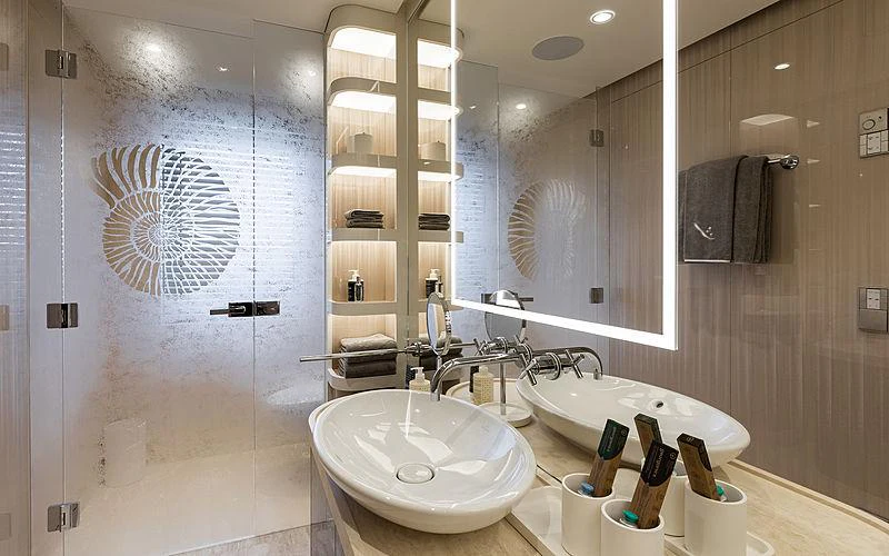 a bathroom with a large mirror aboard SOARING Yacht for Charter