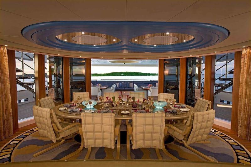 a dining room with a table set aboard SYCARA V Yacht for Charter