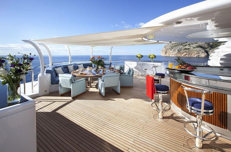 a large open area with a large patio and a large pool aboard SYCARA V Yacht for Charter