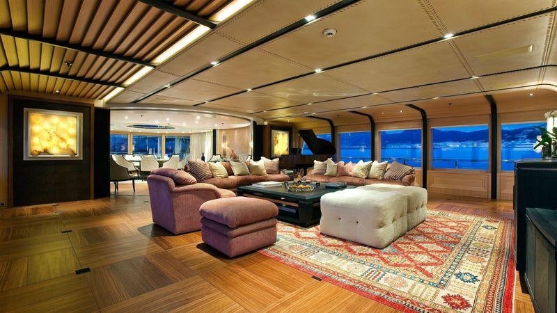 a living room with a large rug aboard VENTUM MARIS Yacht for Charter