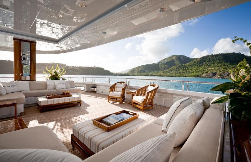 a living room with a large balcony aboard INVICTUS Yacht for Charter