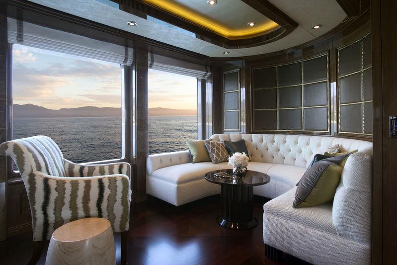 a living room with a large window aboard INVICTUS Yacht for Charter