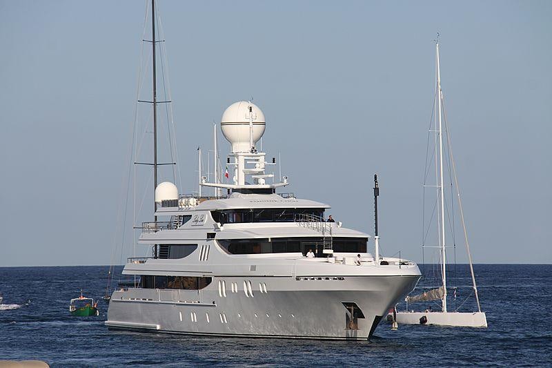 a large white boat in the water aboard JOIA THE CROWN JEWEL Yacht for Charter