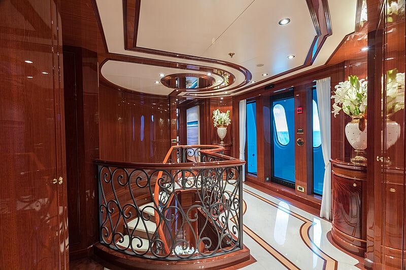 a room with a balcony aboard JOIA THE CROWN JEWEL Yacht for Charter