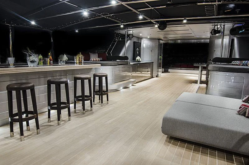 a large kitchen with a table and chairs aboard MAGNA GRECIA Yacht for Charter