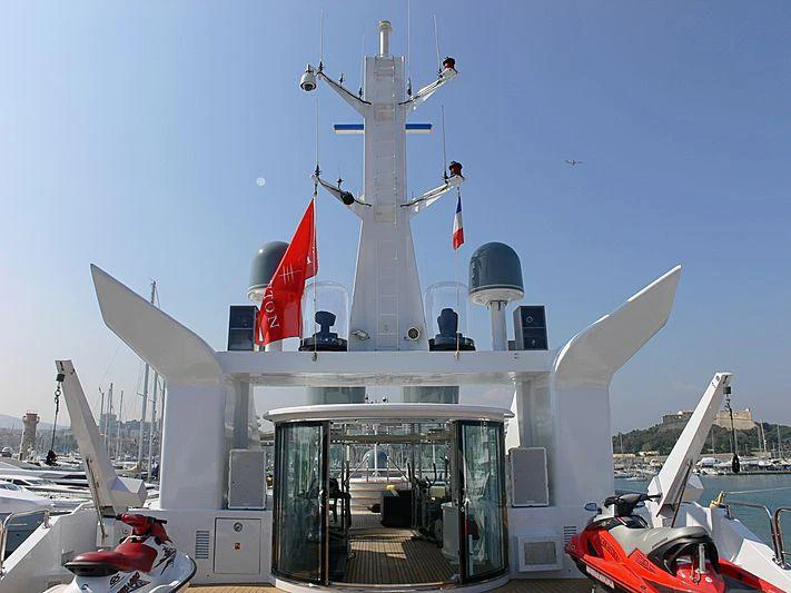a white ship with a red and blue roof and a white tower with a white dome and a aboard MAGNA GRECIA Yacht for Charter
