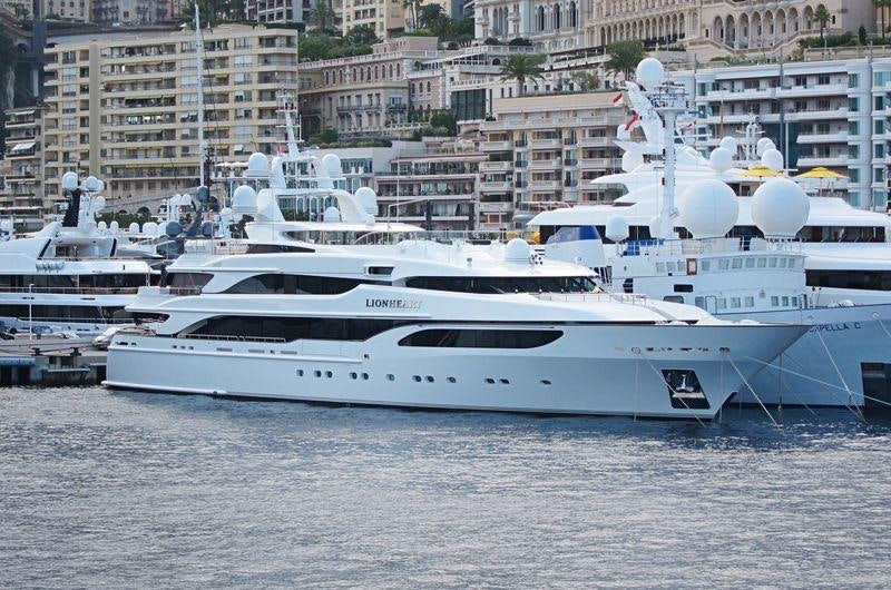 a white yacht in the water aboard LIONESS V Yacht for Charter