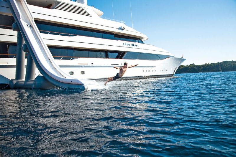 a person jumping out of a boat aboard LADY BRITT Yacht for Charter