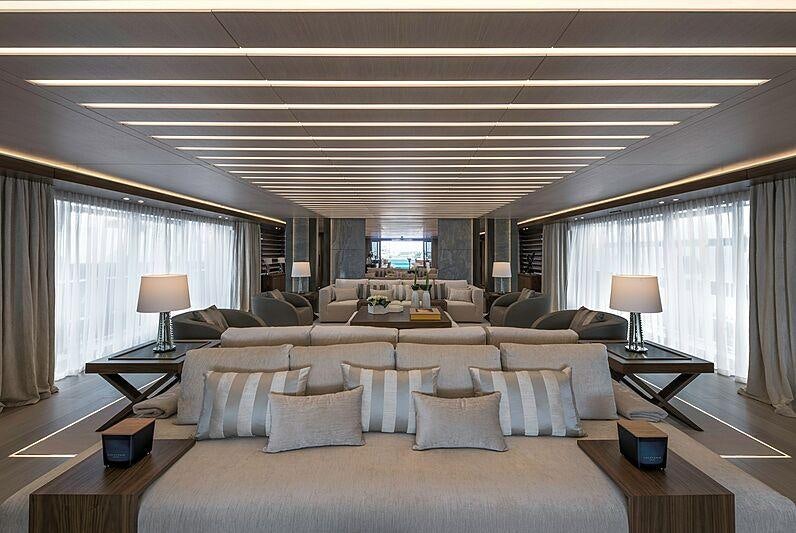 a large living room with a large window aboard UTOPIA IV Yacht for Charter