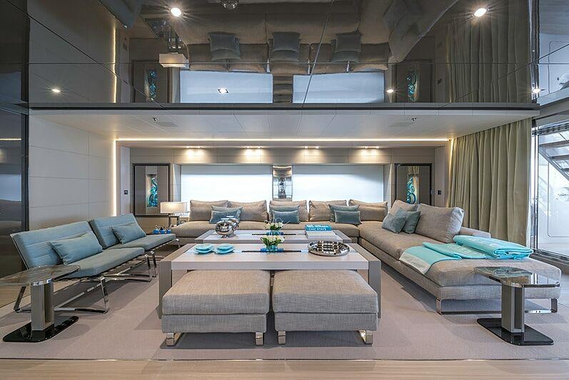 a living room with a couch and a table aboard UTOPIA IV Yacht for Charter