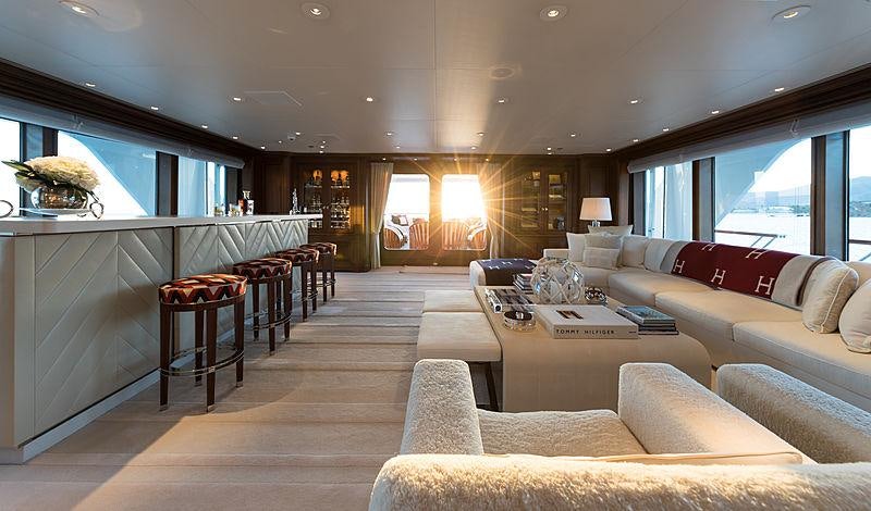 a living room with a large window aboard FLAG Yacht for Charter