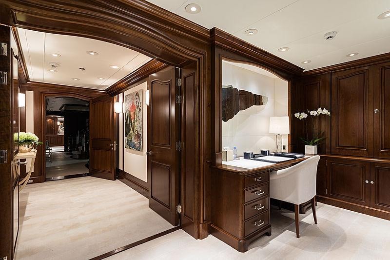 a large kitchen with wooden cabinets aboard FLAG Yacht for Charter
